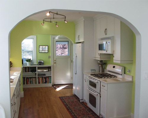 A dated West Seattle kitchen benefits tremendously from new cabinets, paint and lighting