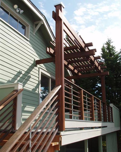 The railings are built from Ipea and steel spacers.  Ipea is a very dense tropical hardwood that holds up very well in the Pacific Northwests damp climate