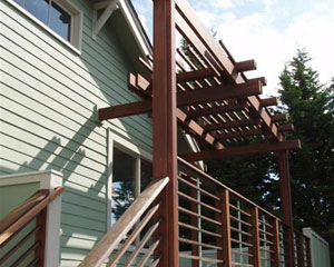 The railings are built from Ipea and steel spacers.  Ipea is a very dense tropical hardwood that holds up very well in the Pacific Northwests damp climate