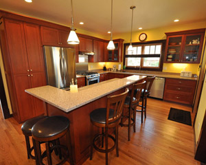The new kitchen is spacious, with a center island and raised counter