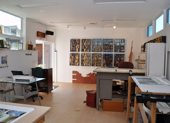 P's studio, while technically a daylight basement, is truly filled with light, from windows and doors to the South and clerestory windows to the North.  The West wall was left purposely windowless to allow art pieces to be hung and worked on there.