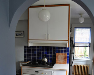 Before:  Poorly remodeled in the '70s with white melamine cabinets and finishes just wrong for this stately home