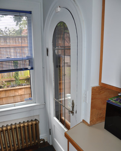 The original kitchen door, in painted white fir and single pane windows had to go
