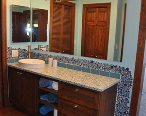 This bathroom facelift - no walls were moved - is both value-priced and makes a huge difference in how the bathroom looks and feels.  It's now a cool and colorful oasis.