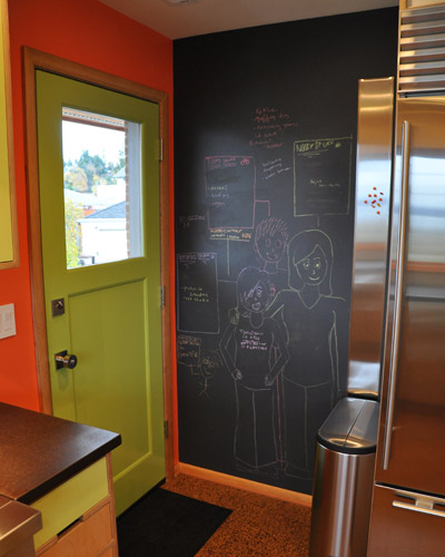 Chalkboard paint makes this easy, and the wall has a bonus too: a magnet board. With stainless appliances, there was nowhere to hang magnets.  This solves that problem stylishly
