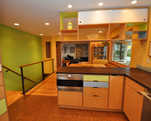 After: clean lines, green materials, and brightly painted walls. A unique and playful mid-century modern kitchen