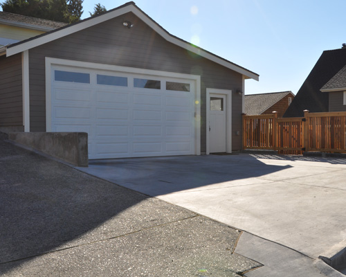 From the alley, vehicles can easily enter and exit the garage, and there is enough space to park additional vehicles outside.  A practical West Seattle garage construction