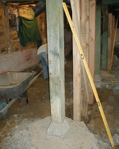 During: digging the floor to extend the basement. Craftsman addition Seattle.