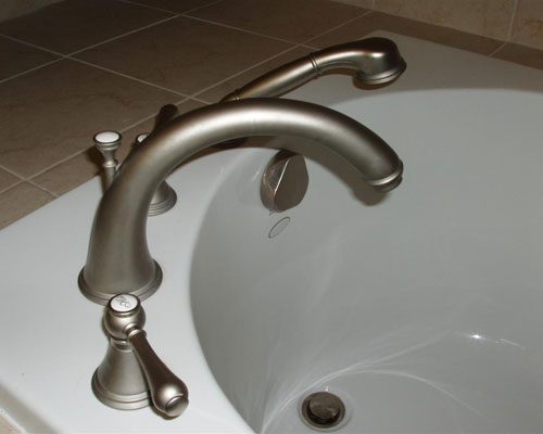 New fixtures and high-quality tile finish off the bathroom remodel by seattle custom home builder