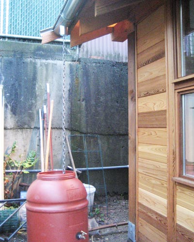 All of the design elements are focused around the garden, including this rain barrel, which provides additional irrigation
