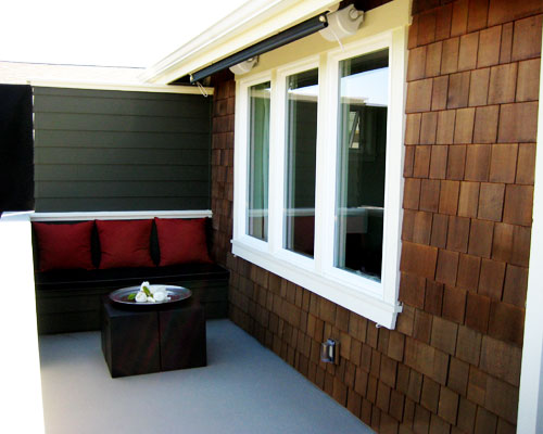 Remodels tend to uncover surprises.  With this project, the surprise was that ductwork heating the master bedroom was much higher than expected.  The solution: create a bench seating area in the corner in this Seattle balcony remodel