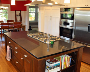 custom cabinets with stained cherry island and quartz counter