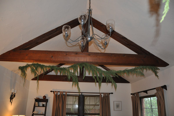 The 1930s brick Tudor had seen a kitchen remodel fairly recently, but the fussy details did not compliment either the house generally, or one of the primary architectural features in the home - rustic hand-hewn open beams through the living room