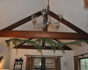 The 1930s brick Tudor had seen a kitchen remodel fairly recently, but the fussy details did not compliment either the house generally, or one of the primary architectural features in the home - rustic hand-hewn open beams through the living room