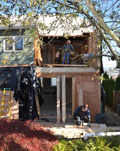 We removed the bath, removed the roof and framed in a new dormer that extended a mere 100sf at the main level.  But that extra square footage allowed a sea change in the spaces at both the upper and main floors