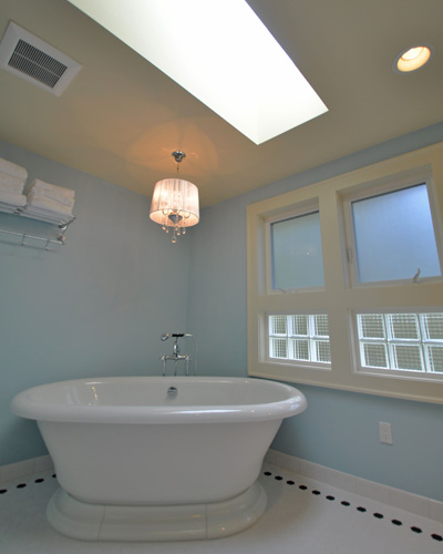 And finally, the tub: a cast iron beauty with a chrome riser to fill it.  The train rack to the left holds towels. It's hard not to imagine relaxing inside the spacious soaker