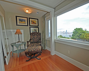 With a new master closet, this former closet space gets a new mission: reading nook.  With a view of the city like this, it might be easy to get distracted, though