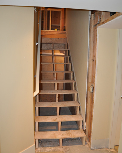 The stairs to the basement also get a remodel.  Formerly described as treacherous, these expanded treads end up navigable and beautiful with some carpet installed