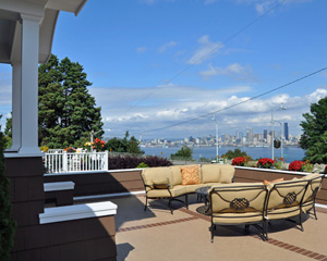 Even the front deck over the garage gets a refresh. with a new paint job and furniture designed to take in the view.  Custom deck Seattle