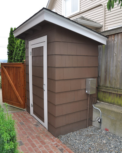 A storage shed was added beside the house to match exterior colors. Seattle custom storage projects