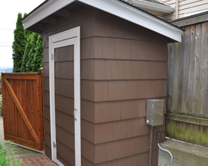 A storage shed was added beside the house to match exterior colors. Seattle custom storage projects