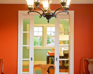 The home office has glass double pocket doors on two walls, which allows for noise control when necessary, but keeps light flowing through the room.