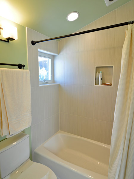 A small window in the shower area brings in even more light