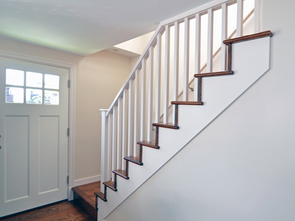 Viewed from the living room, the stairs are now an architectural feature and an attractive invitation to go upstairs instead of an afterthought