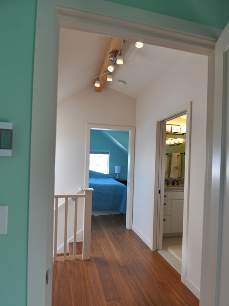 New carbonized bamboo flooring throughout the upstairs along with bright paint colors make this a comfortable and light-filled space the whole family can now use