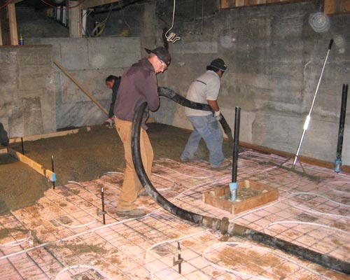 The solution: removing the slab and digging down.  We took out the foundation in 4-foot sections and poured a new, lower foundation to create excellent head height