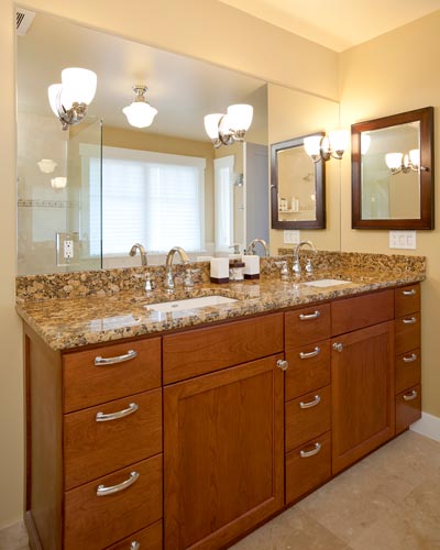 A roomy double vanity and lots of mirrors make this master bathroom feel more like a spa