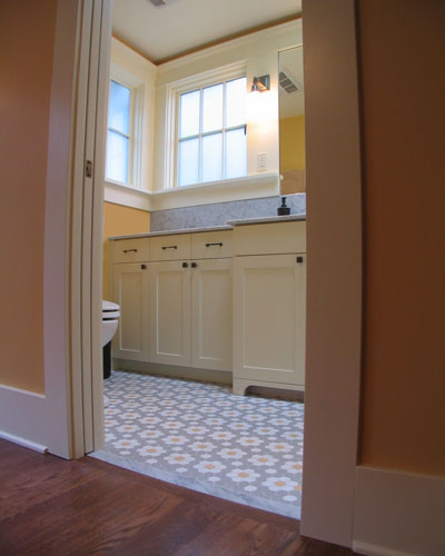 The star of this project is the bathroom, with furniture-style custom cabinetry