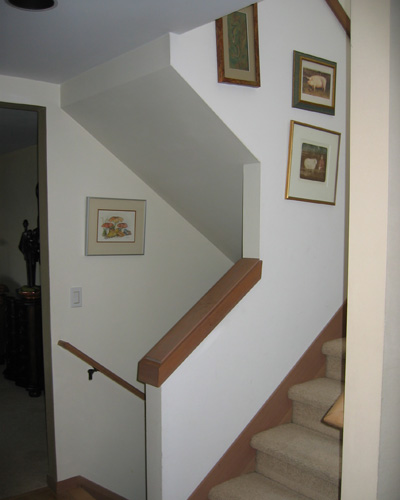 Before: Classic '80s stairs with knee walls and carpet had to go