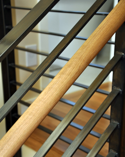 and the steel railings and oak handrail carry the same finishes through from the floor below
