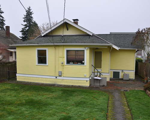 Part of the trick was adding only to the rear of the home, and with a side gable that matches the one you see to the right, and extending the peak of the roof to include the addition