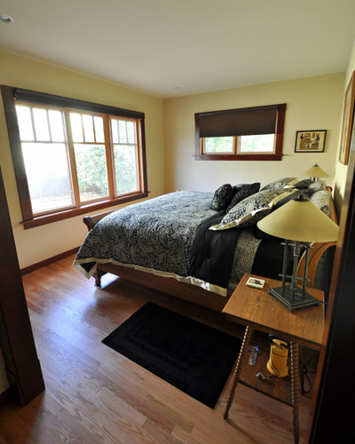 A light-filled master bedroom looks out on the fenced backyard - private but spacious.