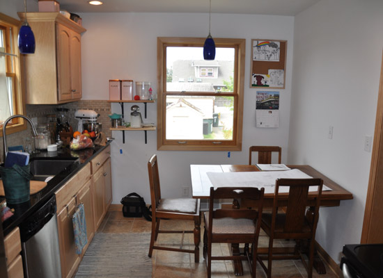 The new opening to the addition is at the end of the kitchen, which had been recently remodeled with Big Box store finishes.  That actually made it easy to accomplish a minor kitchen remodel along with the addition. Even the tile was still in stock