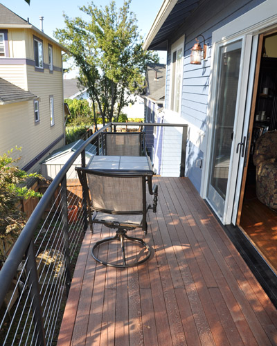 The final big change is at the deck. The previous insert fireplace was situated to take up nearly all of the deck space, leaving only a few feet on each side. Failing railings needed to be replaced as well