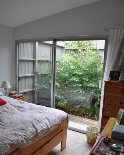 The master bedroom was tiny too, with a sliding door into a fairly large exterior atrium area.  It was lost space that couldn't afford to be lost.  The decision was made to take it over as part of the master bedroom to allow more space in the bathroom and closet