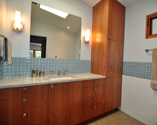 The heated floor makes this room feel luxurious, and a far cry from the tiny space it started out as.  Note the stain on the fir windows, chosen to match the color of cherry used elsewhere in the home