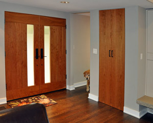 The doors also add color to the living room, where a single closet door was also replaced in cherry.  The red of the cherry works well with the dark stain on the oak floors used here, in the dining room and hall, and into the new master bedroom