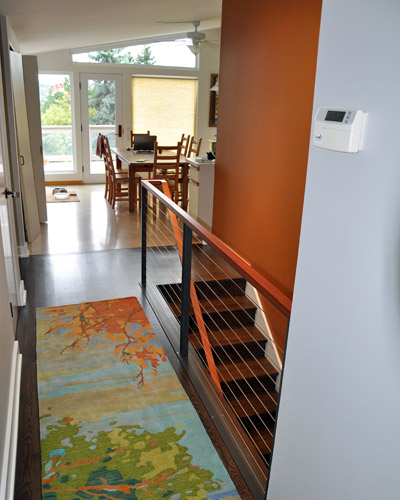 Finally, the stairs to the basement were revisioned, replacing old carpeted treads and white picket railings