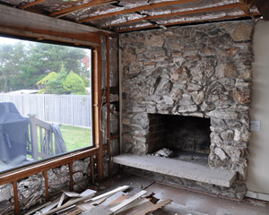 Before, the living room had a big rock fireplace surround in one corner