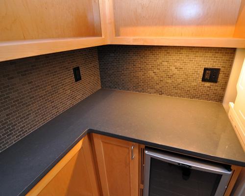 We especially like the tile backsplash and the under cabinet lighting