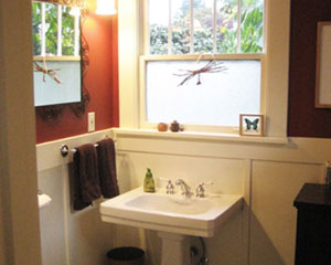 This powder bath had its door relocated to a new wall and the tub removed.  But it stays true to its original look