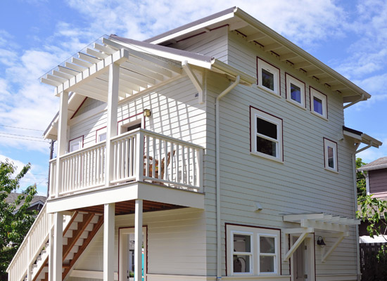 A comfortable flight of exterior stairs provides access to the main living area, with a glass-covered, trellised entry landing.  There's even enough room for a patio chair