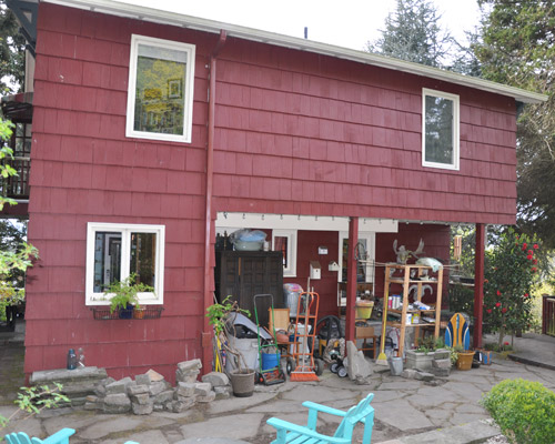 You have to see the outside before the work to understand.  A cantilevered upper floor addition loomed over the main floor.  The small area to the left is the end of the kitchen.  No access to the back yard from the back of the house.