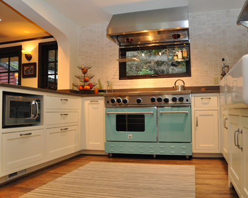 The cabinets are mix of mahogany and painted, with the painted cabinets in the kitchen proper and the mahogany on the dining room side and in the butler's pantry/desk area