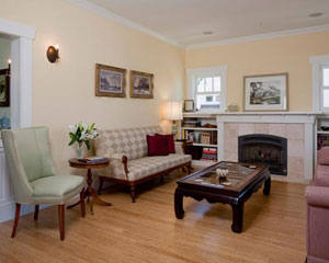 The living room's focal point is the built-in cabinets and fireplace.