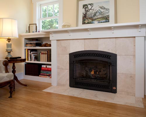 A gas insert fireplace means no smoke and instant warmth in the winter
